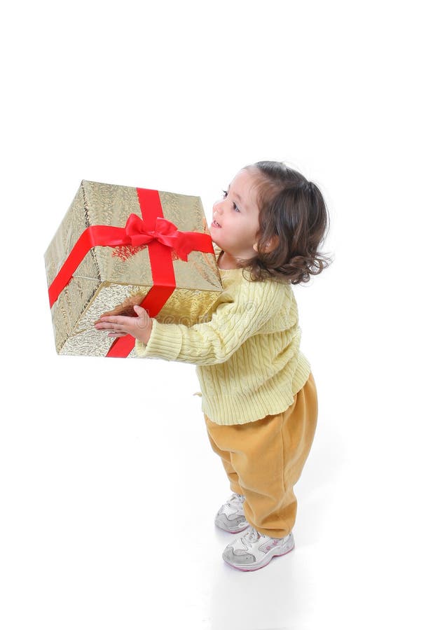 Niño con un regalo de la Navidad imágenes de archivo libres de regalías Niño con un regalo de la Navidad imágenes de archivo libres de regalías