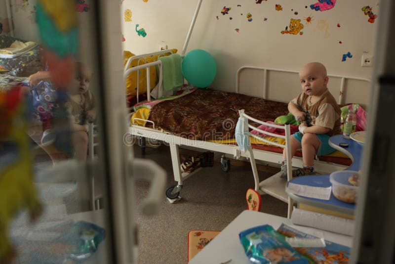 Tomsk, Russia - June 25, 2009: Unidentified child in pediatric oncohematological department on Tomsk Regional Clinical Hospital. The Department of Pediatric Oncology and Hematology. Tomsk Regional Clinical Hospital. Ill children live here together with their mothers. Leukemia (a blood cancer), anemia, hemophilia â€“ these diseases rank second in the statistics of mortality of children under the age of 14. First rank is the accidents (injuries and poisoning). In case of blood cancer the most important thing is to diagnose it in time. If the illness was detected early and the treatment was picked up correctly, the probability of treatment or transition in a condition of long remission at children makes 80-90 percent. In Russia during the last years the survival rate at a blood cancer has grown with 4 to 80 percent. Tomsk, Russia - June 25, 2009: Unidentified child in pediatric oncohematological department on Tomsk Regional Clinical Hospital. The Department of Pediatric Oncology and Hematology. Tomsk Regional Clinical Hospital. Ill children live here together with their mothers. Leukemia (a blood cancer), anemia, hemophilia â€“ these diseases rank second in the statistics of mortality of children under the age of 14. First rank is the accidents (injuries and poisoning). In case of blood cancer the most important thing is to diagnose it in time. If the illness was detected early and the treatment was picked up correctly, the probability of treatment or transition in a condition of long remission at children makes 80-90 percent. In Russia during the last years the survival rate at a blood cancer has grown with 4 to 80 percent.