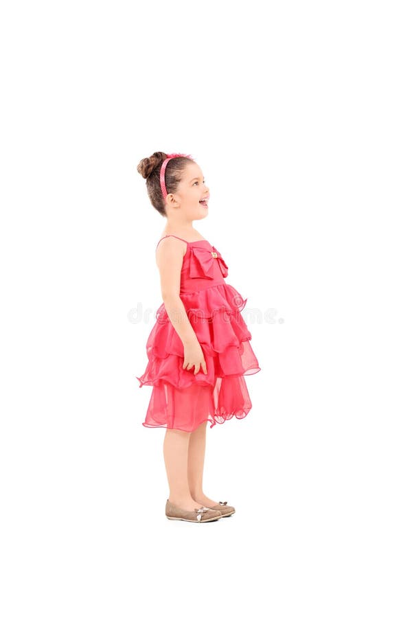 Profile shot of a cute kid in fancy dress looking up isolated on white background. Profile shot of a cute kid in fancy dress looking up isolated on white background