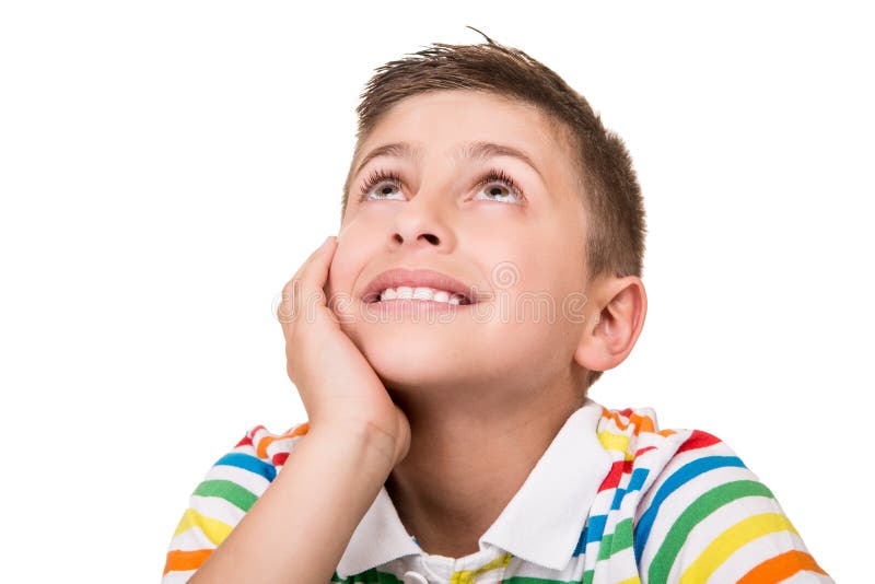 Niño que piensa sobre blanco imagen de archivo