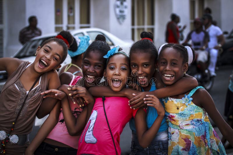 Smiling Cuban children at the traditional holidays in the city of Santiago de Cuba. Smiling Cuban children at the traditional holidays in the city of Santiago de Cuba