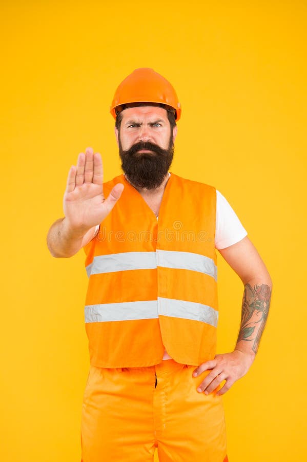 No entry. Man engineer protective uniform stop you. Architect builder engineer. Protective apparel for construction royalty free stock photos No entry. Man engineer protective uniform stop you. Architect builder engineer. Protective apparel for construction royalty free stock photos