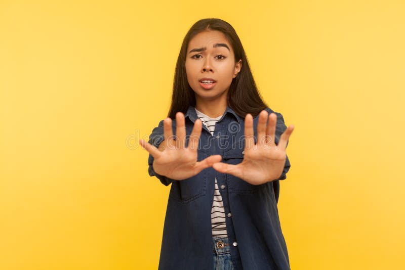 No I`m Afraid Portrait Of Scared Girl In Denim Shirt Standing With Raised Hands Stop Gesture