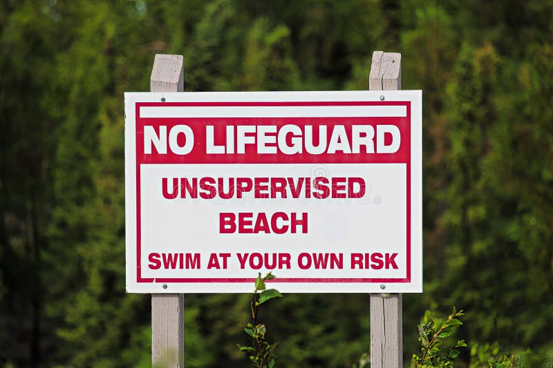 A No Lifeguard Unsupervised Beach Use at Own Risk Sign Stock Photo ...