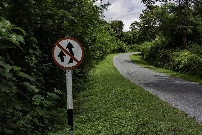 No overtaking sign along curve road