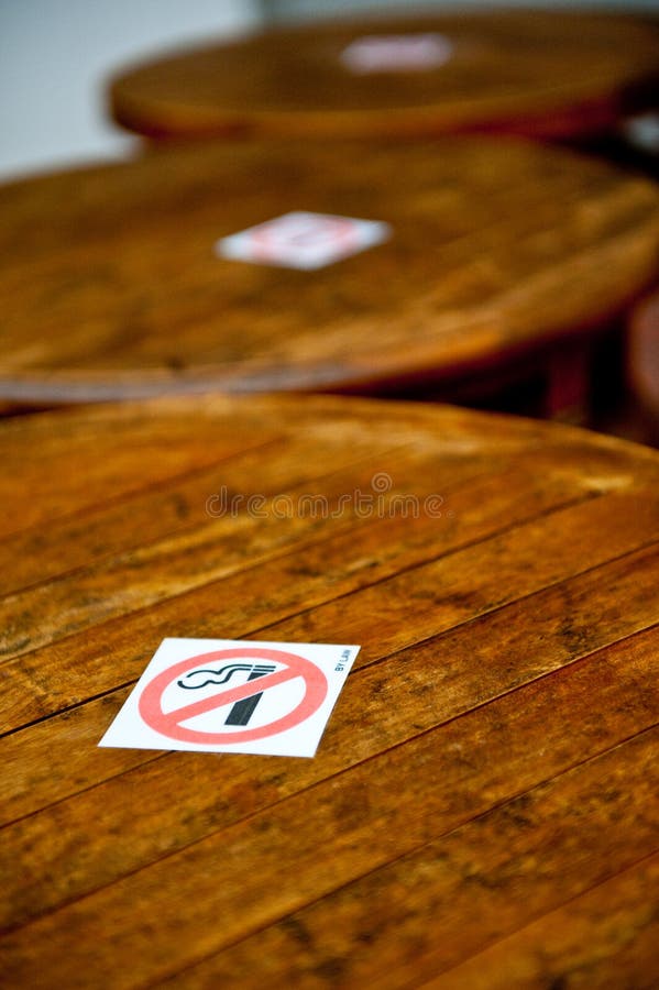 No smoking sign on tables