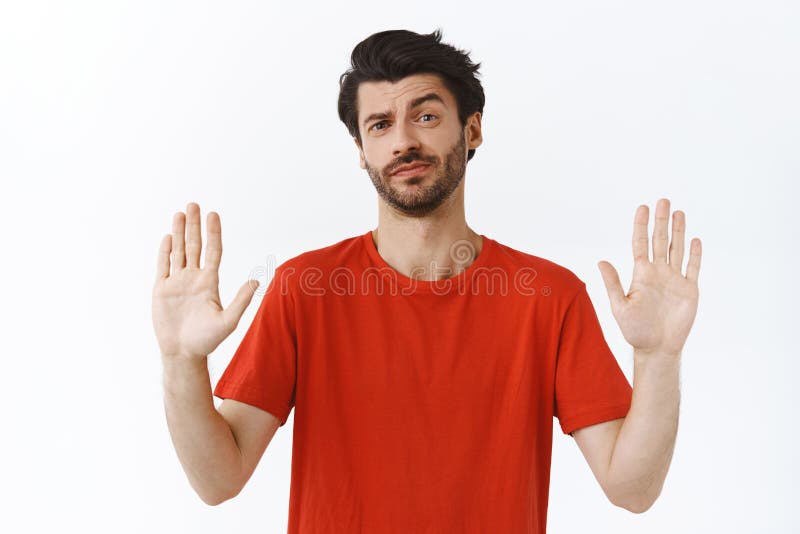 No thanks, I refuse. Portrait of displeased intense attractive  african-american man with beard and moustache, pulling palms towards camera  in stop or rejection gesture, expressing dislike and disgust Stock Photo