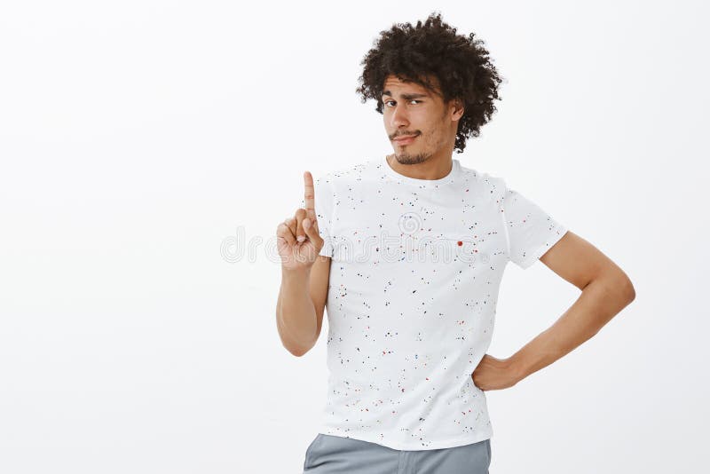 No, you cannot. Portrait of bossy good-looking dark-skinned male model in casual outfit waving index finger in not royalty free stock photo No, you cannot. Portrait of bossy good-looking dark-skinned male model in casual outfit waving index finger in not royalty free stock photo