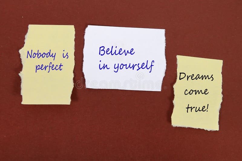 Nobody is perfect. Believe in yourself. Dreams come true! Note pin on the bulletin board royalty free stock photo Nobody is perfect. Believe in yourself. Dreams come true! Note pin on the bulletin board royalty free stock photo