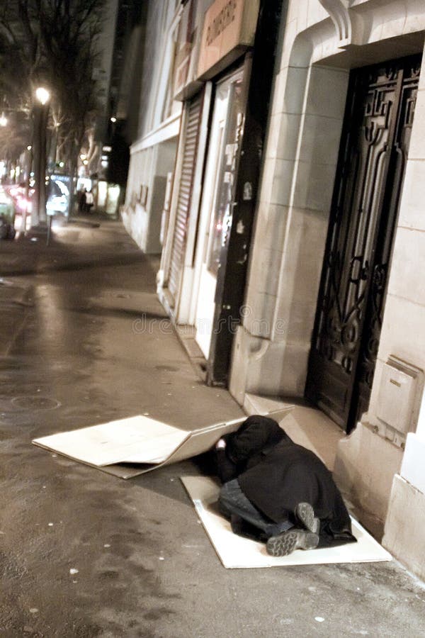 Parisian night, beggar. Poverty in a city. France, Paris. Parisian night, beggar. Poverty in a city. France, Paris