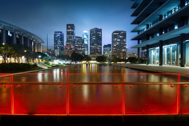 Downtown Los Angeles skyline reflects in water at night. Downtown Los Angeles skyline reflects in water at night.