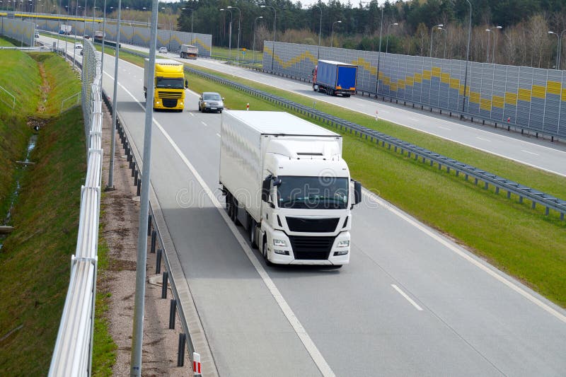 Traffic. Acoustic wall that protects residents against noise gen stock photo Traffic. Acoustic wall that protects residents against noise gen stock photo