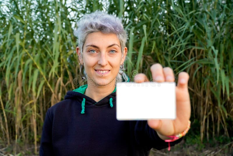 Nonbinary Person Claims Gender Identity with a White Card Stock Photo