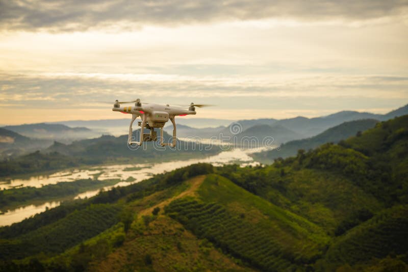 Nong Khai; Thailand - Jan 3; 2017: Drone Dji Phantom 3 with high resolution digital camera. Flying camera take a photo and video at `PHU PHA DAK` best view point of mountain and Mekong river.