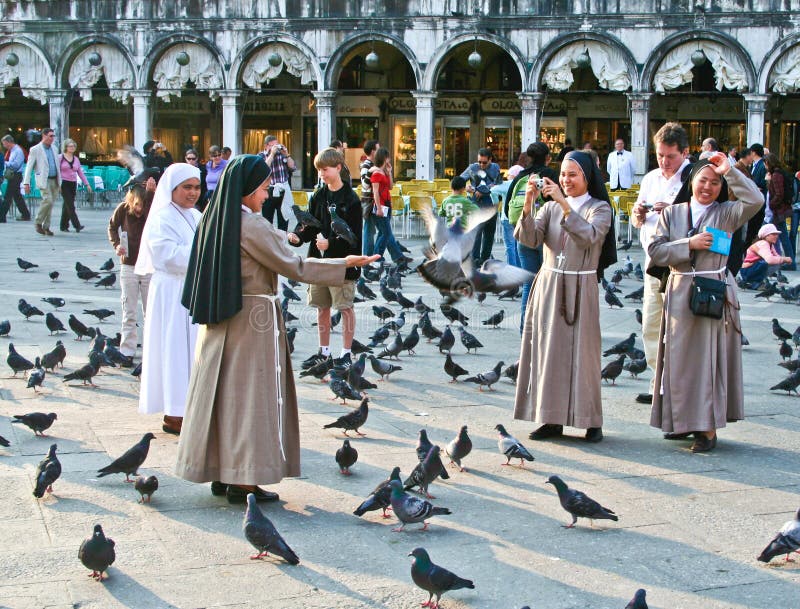 Nons on San Marco square feed pigeons