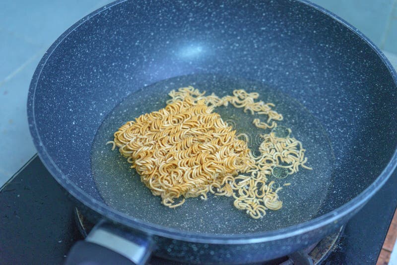 Noodles in boiling water stock image. Image of soup 110377607