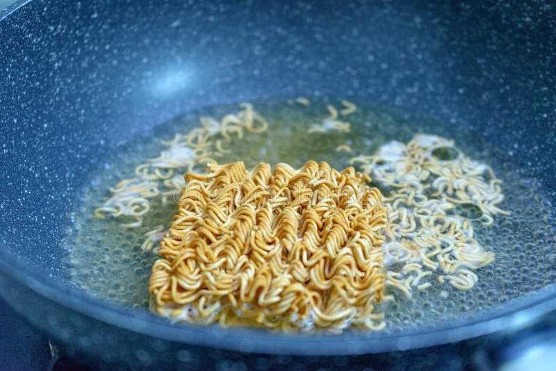 Noodles in boiling water stock image. Image of soup 110377607