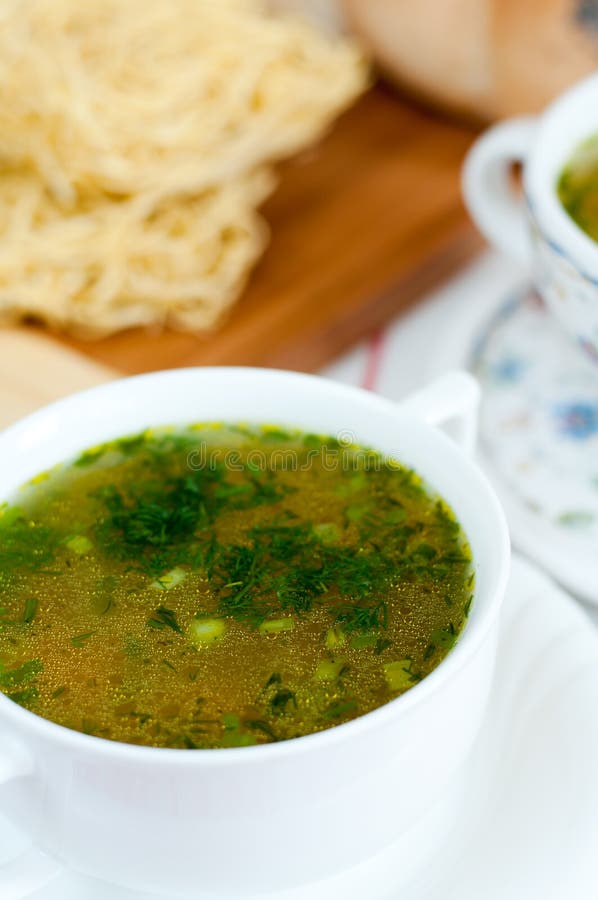Noodles in chicken broth stock photo. Image of herbs 27406962