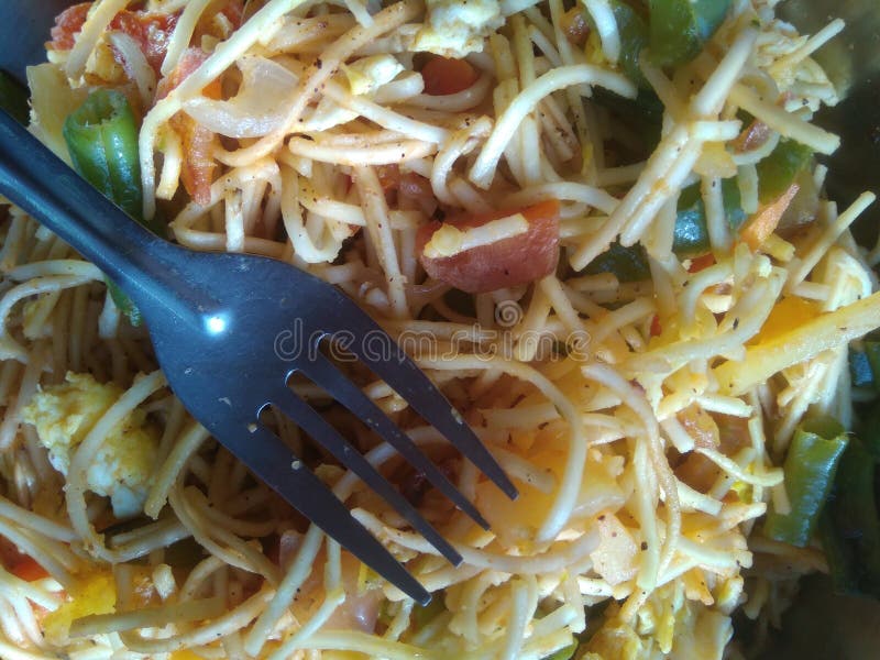 Noodles mixed with home made vegetables cropped and close display with selective focus. Asian food. royalty free stock image