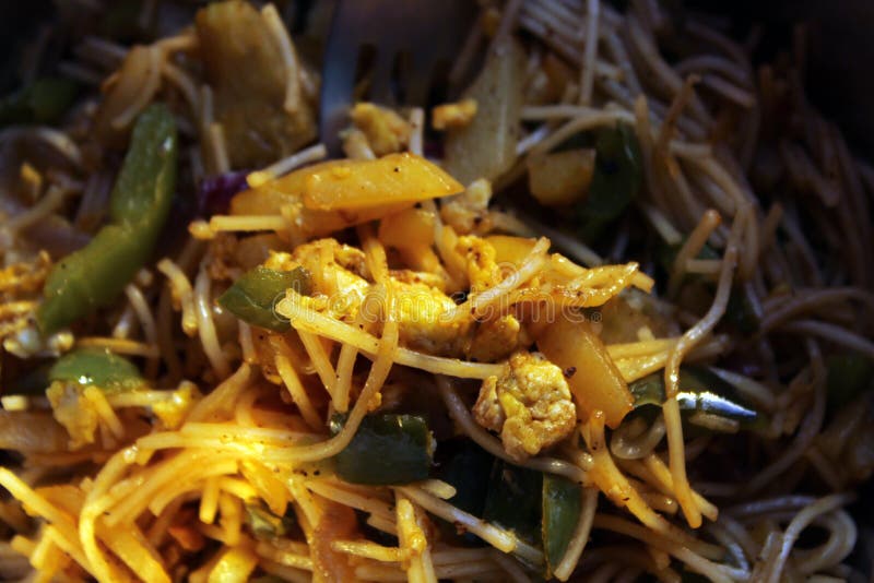 Noodles mixed with home made vegetables cropped and close display with selective focus. royalty free stock image