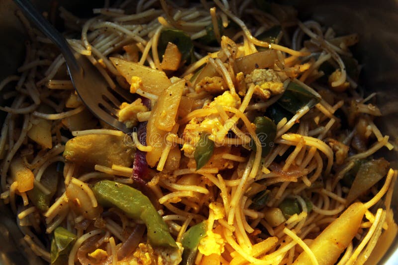 Noodles mixed with home made vegetables cropped and close display with selective focus. stock images