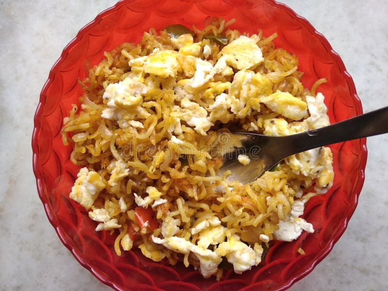 Noodles mixed with home made vegetables and eggs cropped and close display with selective focus. Asian food. stock photo
