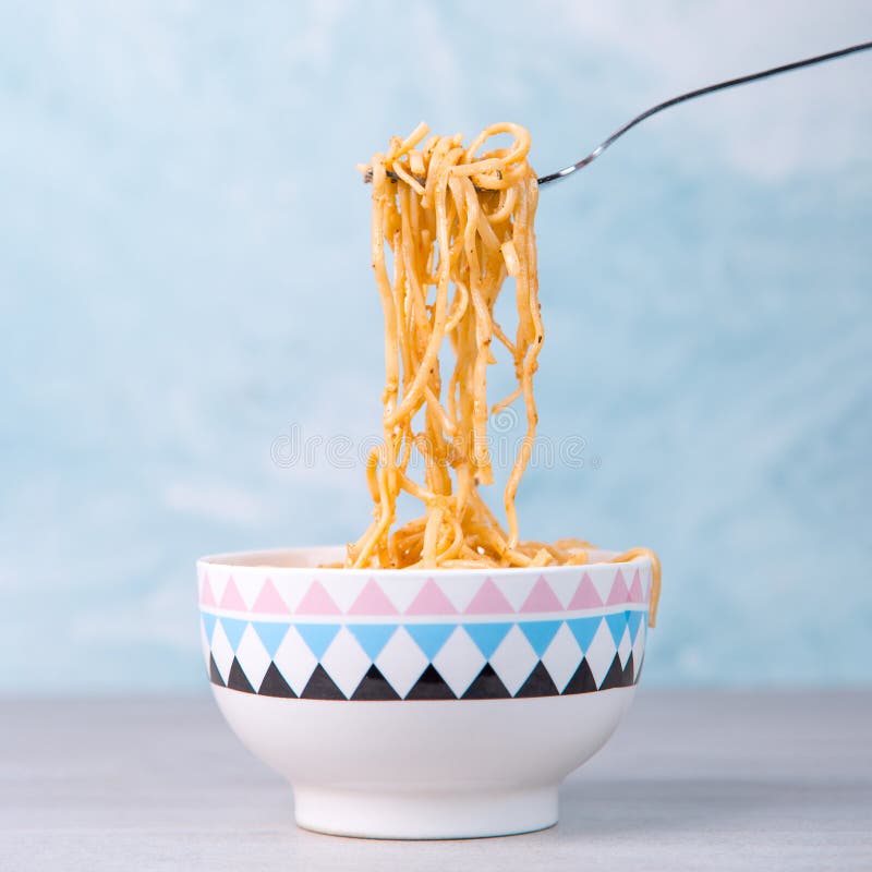 Noodles with Sauce in a Colored Bowl with Fork, Appetite Spaghetti on a