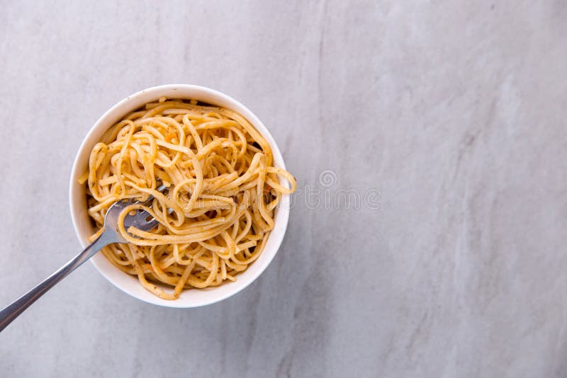 Noodles with Sauce in a Colored Bowl with Fork, Appetite Spaghetti on a