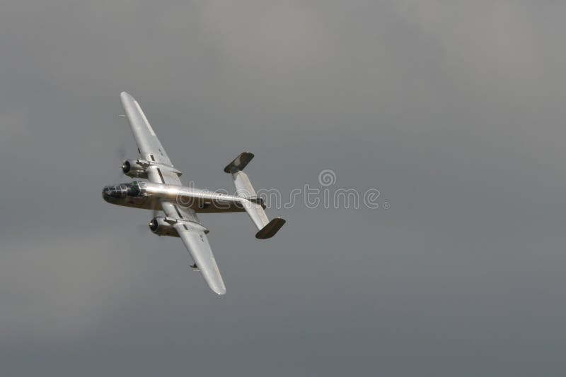 Duxford Flying Legends UK JULY, 11, 2015 North American B-25 Mitchell american bomber propeller airplane of World War 2 used in 1942 for the Doolittle Raid to bomb Tokyo and other places in Japan. Duxford Flying Legends UK JULY, 11, 2015 North American B-25 Mitchell american bomber propeller airplane of World War 2 used in 1942 for the Doolittle Raid to bomb Tokyo and other places in Japan