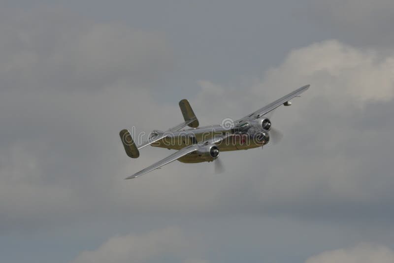 Duxford Flying Legends UK JULY, 11, 2015 North American B-25 Mitchell american bomber propeller airplane of World War 2 used in 1942 for the Doolittle Raid to bomb Tokyo and other places in Japan. Duxford Flying Legends UK JULY, 11, 2015 North American B-25 Mitchell american bomber propeller airplane of World War 2 used in 1942 for the Doolittle Raid to bomb Tokyo and other places in Japan