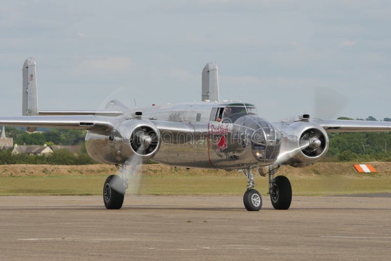 Duxford Flying Legends UK JULY, 11, 2015 North American B-25 Mitchell american bomber propeller airplane of World War 2 used in 1942 for the Doolittle Raid to bomb Tokyo and other places in Japan. Duxford Flying Legends UK JULY, 11, 2015 North American B-25 Mitchell american bomber propeller airplane of World War 2 used in 1942 for the Doolittle Raid to bomb Tokyo and other places in Japan