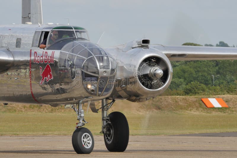 Duxford Flying Legends UK JULY, 11, 2015 North American B-25 Mitchell american bomber propeller airplane of World War 2 used in 1942 for the Doolittle Raid to bomb Tokyo and other places in Japan. Duxford Flying Legends UK JULY, 11, 2015 North American B-25 Mitchell american bomber propeller airplane of World War 2 used in 1942 for the Doolittle Raid to bomb Tokyo and other places in Japan