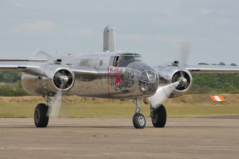 Duxford Flying Legends UK JULY, 11, 2015 North American B-25 Mitchell american bomber propeller airplane of World War 2 used in 1942 for the Doolittle Raid to bomb Tokyo and other places in Japan. Duxford Flying Legends UK JULY, 11, 2015 North American B-25 Mitchell american bomber propeller airplane of World War 2 used in 1942 for the Doolittle Raid to bomb Tokyo and other places in Japan