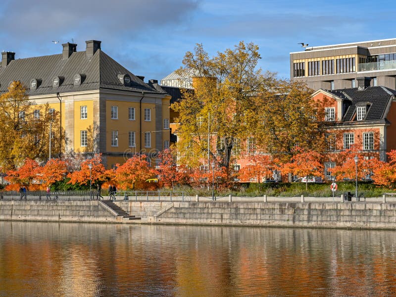 Norrkoping waterfront Saltangen and Motala river during fall. Norrkoping is a historic industrial town in Sweden. Norrkoping waterfront Saltangen and Motala river during fall. Norrkoping is a historic industrial town in Sweden.