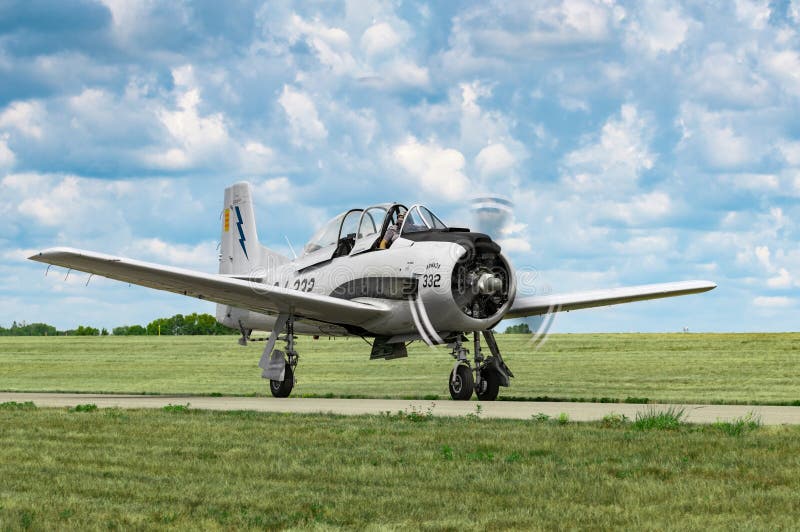 EDEN PRAIRIE, MN - JULY 16 2016: North American T-28a Trojan taxis at air show. Built to replace World War II era trainers, these planes were used as weapons for close air support in Southeast Asia.