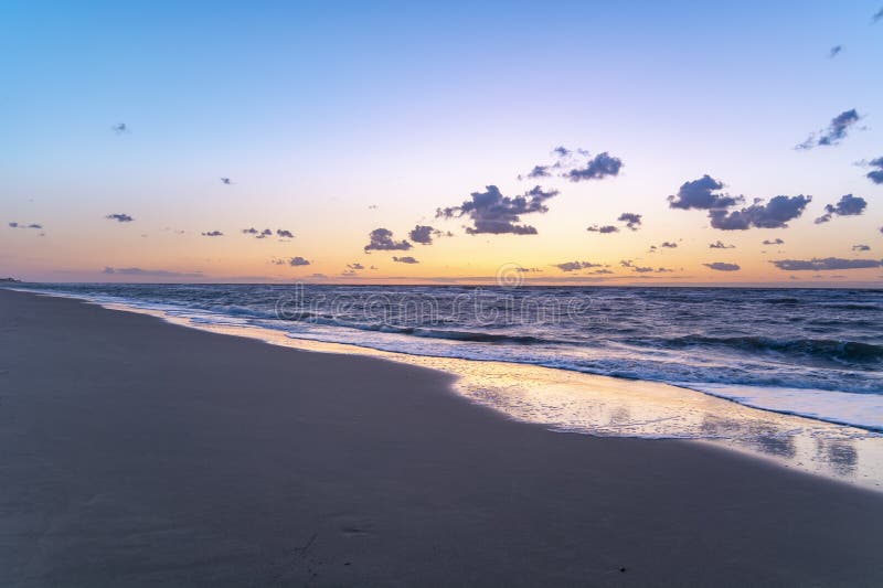 North sea, sandy beach at sunset