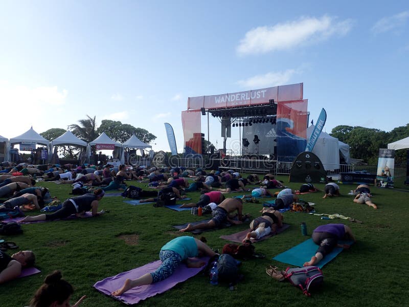 People do Pigeon Pose during outdoor yoga class royalty free stock photos People do Pigeon Pose during outdoor yoga class royalty free stock photos
