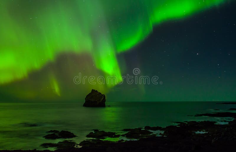 Northern lights above the atlantic ocean.