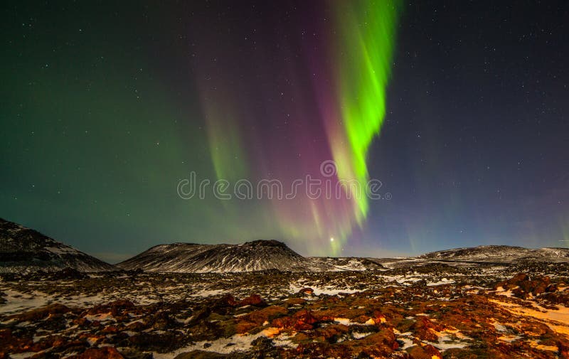Northern lights above the mountains at Reykjanes peninsula in Iceland.