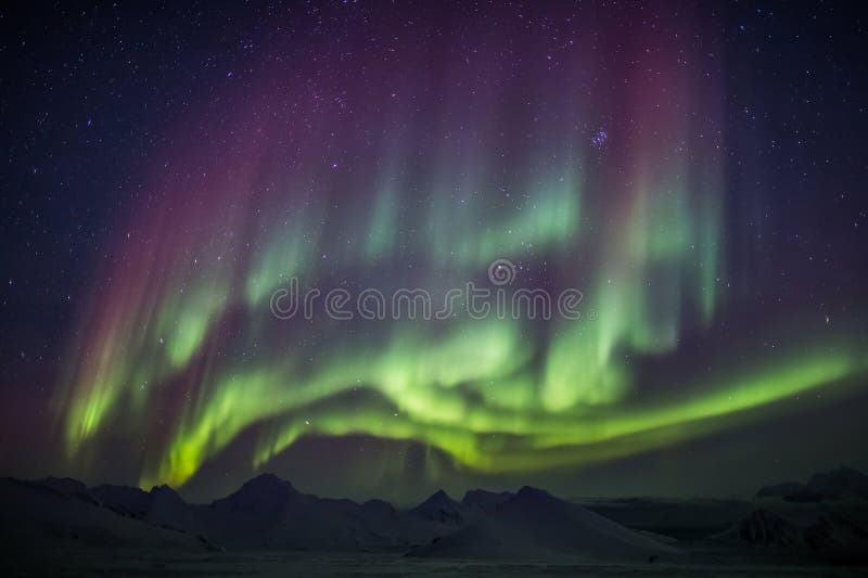 Northern Lights over the Arctic mountains and glaciers - Spitsbergen, Svalbard
