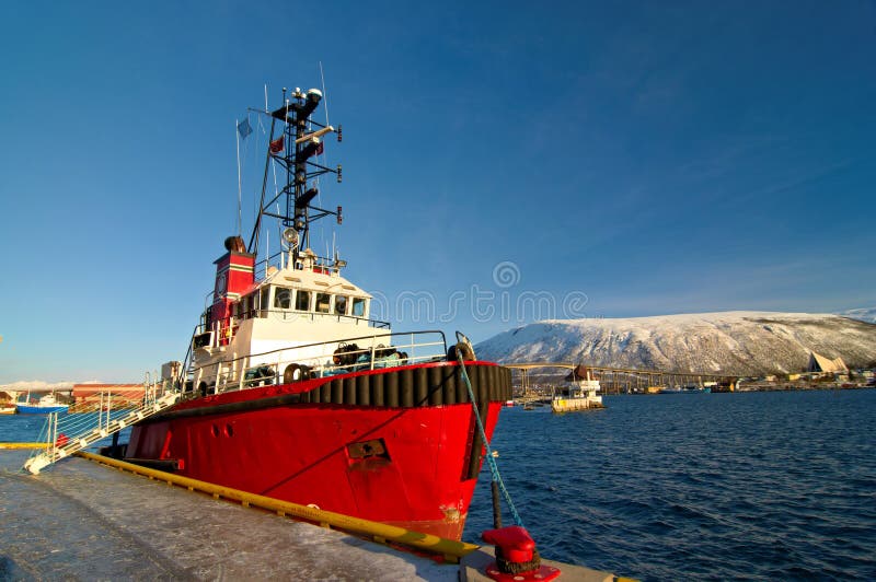 Norwegian fishing boat parked in a harbor in Tromso, city in northern Norway. royalty free stock image Norwegian fishing boat parked in a harbor in Tromso, city in northern Norway. royalty free stock image