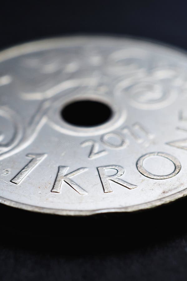 1 Norwegian krone coin close-up. National currency of Norway. Money vertical illustration for news about economy or finance. Bank and loan. Savings and interest. Kroner and Norges Bank. Macro