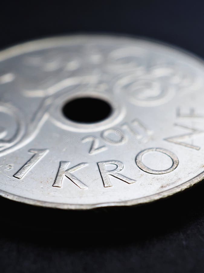 1 Norwegian krone coin closeup. National currency of Norway. Money vertical illustration for news about economy or finance. Loan and credit. Tax and inflation. Crown and central bank of Norway. Macro