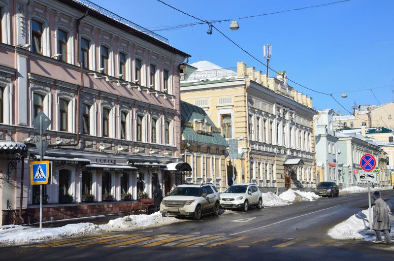 Noscow, Russia, March, 06, 2018.Cars parked on the side of the road prevent from clearing the road from snow on street Podsosensky royalty free stock photo Noscow, Russia, March, 06, 2018.Cars parked on the side of the road prevent from clearing the road from snow on street Podsosensky royalty free stock photo