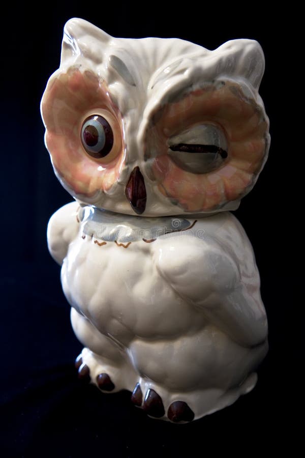 A nostalgic vintage owl cream cookie jar with dramatic lighting. Ceram stock images, royalty-free photos and pictures