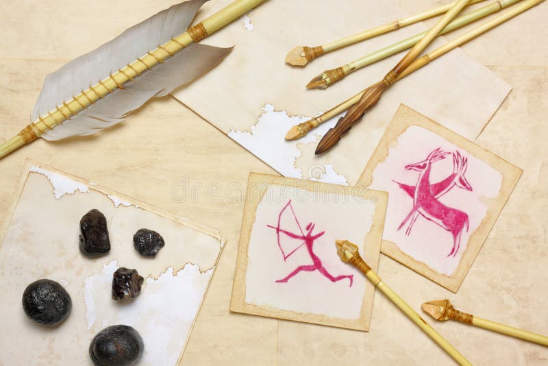 Nostalgic vintage still life with hunting drawings, primitive arrows and hematite lumps over aged paper sheets. Nostalgic vintage still life with hunting drawings, primitive arrows and hematite lumps over aged paper sheets