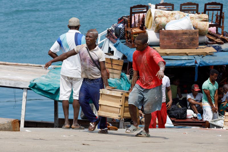 Malagasy peoples loading ship in Nosy Be, Madagascar royalty free stock photos Malagasy peoples loading ship in Nosy Be, Madagascar royalty free stock photos