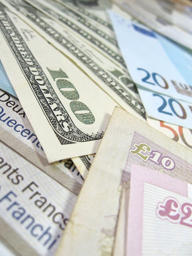 Close-up view of banknotes of various currencies (US dollars, British pounds, Euros and Swiss Francs), with selective focus. Close-up view of banknotes of various currencies (US dollars, British pounds, Euros and Swiss Francs), with selective focus.