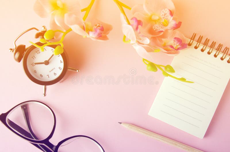 Note pad open empty sheet in rose petals on solid color paper background romantic template stock photography