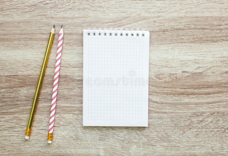 Blank page of vertical spiral sketching pad with crayons on pink  background, flat lay. Back to school Stock Photo - Alamy